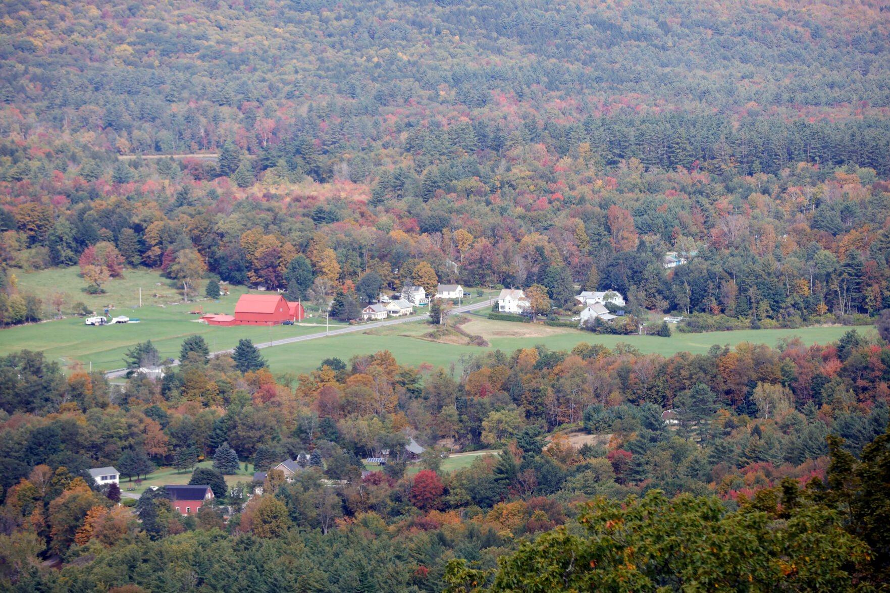 landscape of farms with leaves turning colors